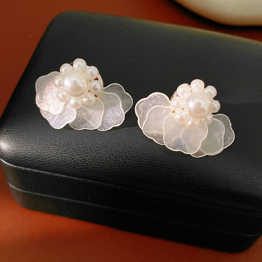 Layered Star-shaped Shell Stud - Cluster Stud Ear recension och pris